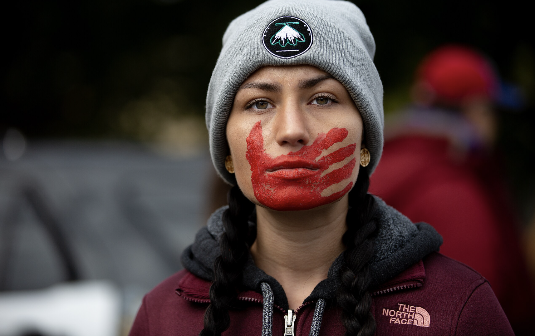 red hand print over mouth