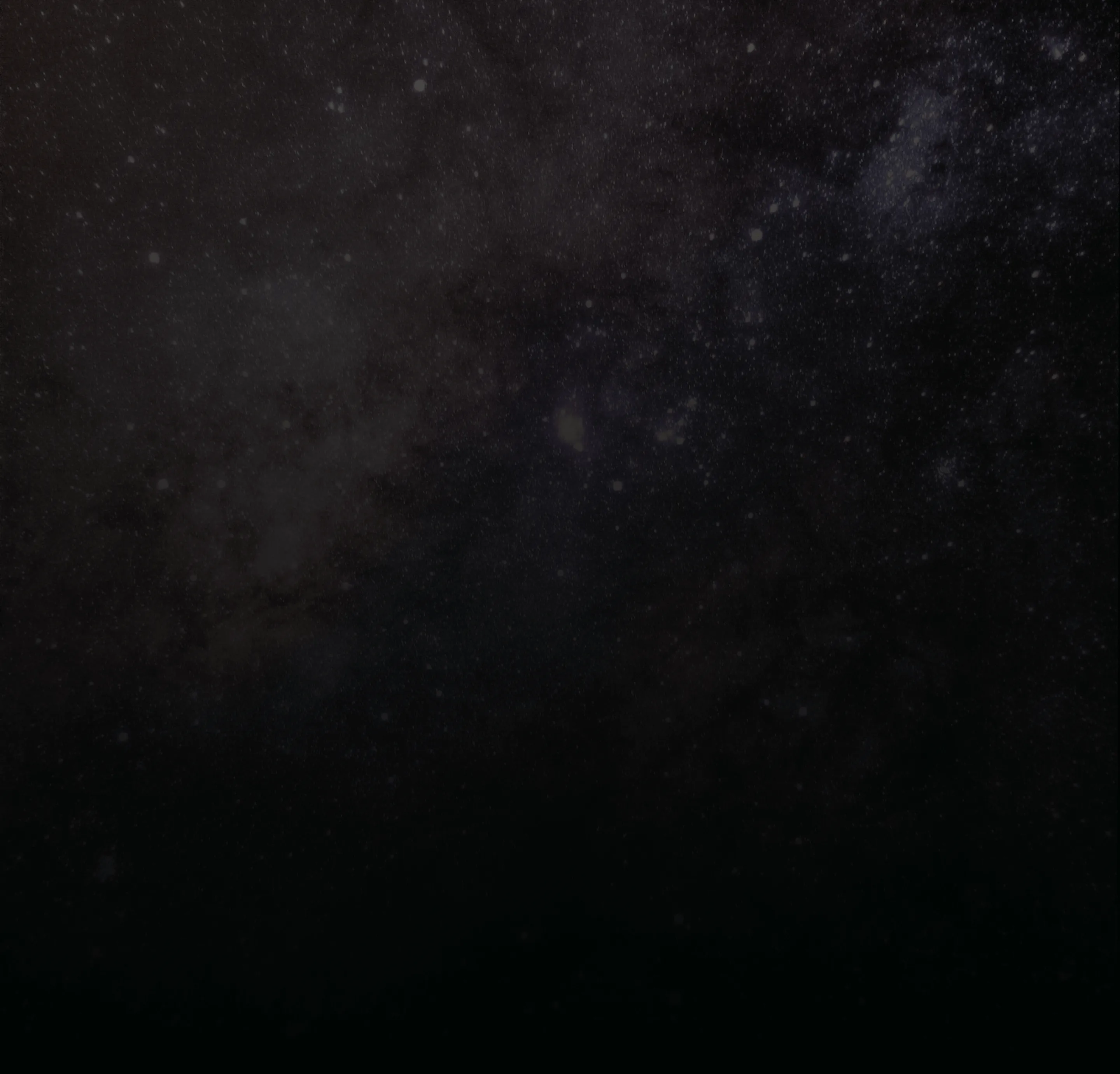 Starry night sky with scattered stars and cosmic dust clouds.