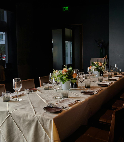 A candlelit private table set before guests arrive