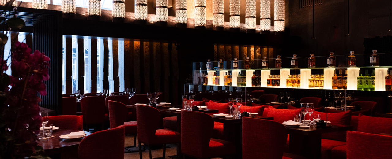 A candlelit private dining room set for dinner