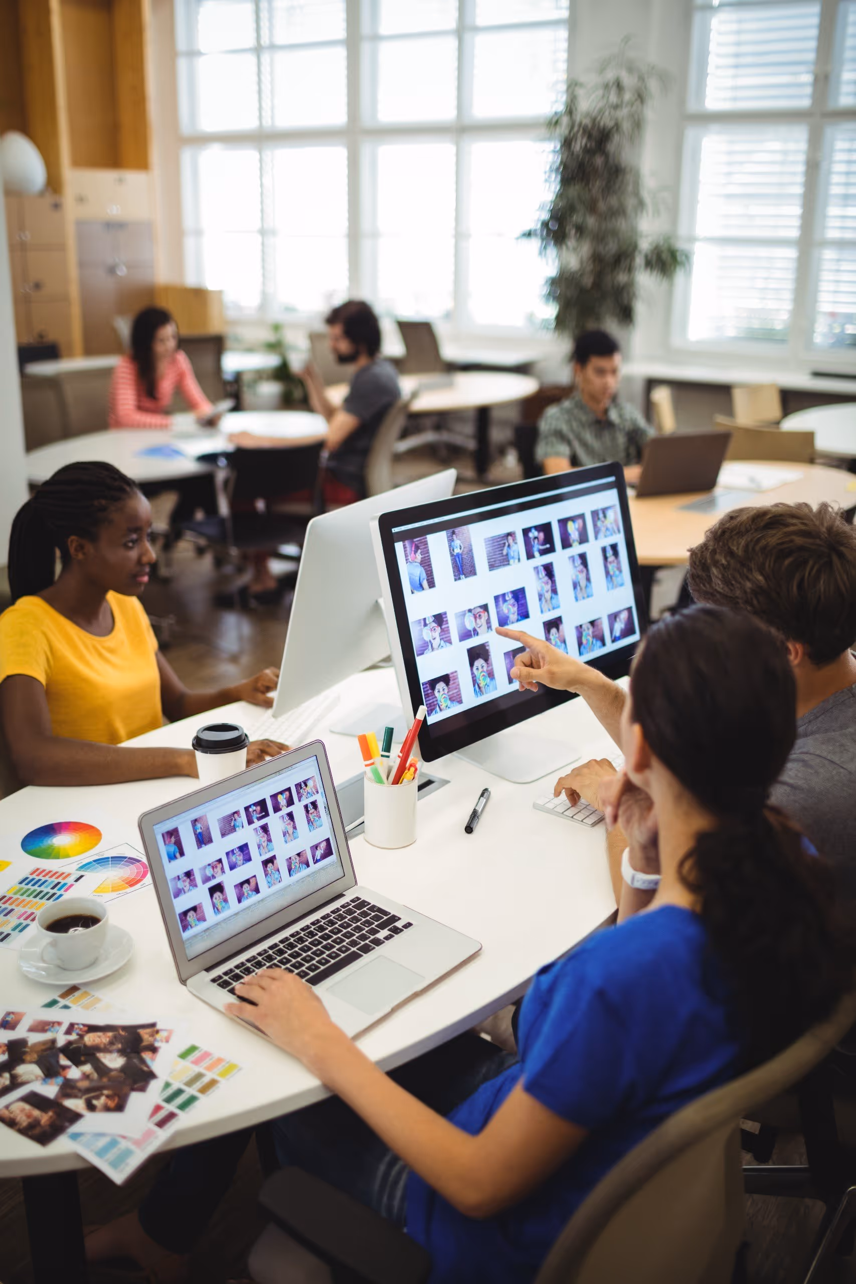 employees working with leptops in office