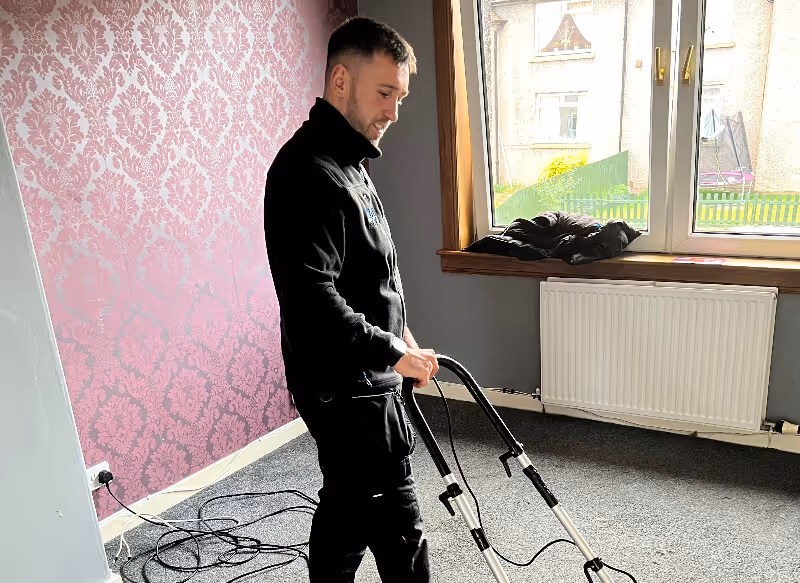 Sean cleaning a carpet