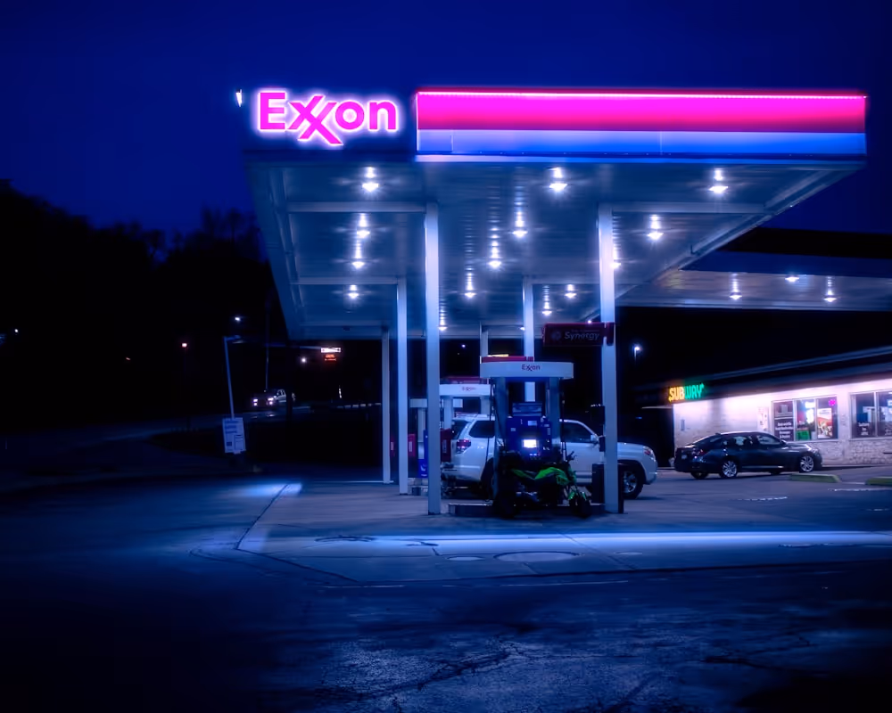 cars parked in front of UNKs store during night time