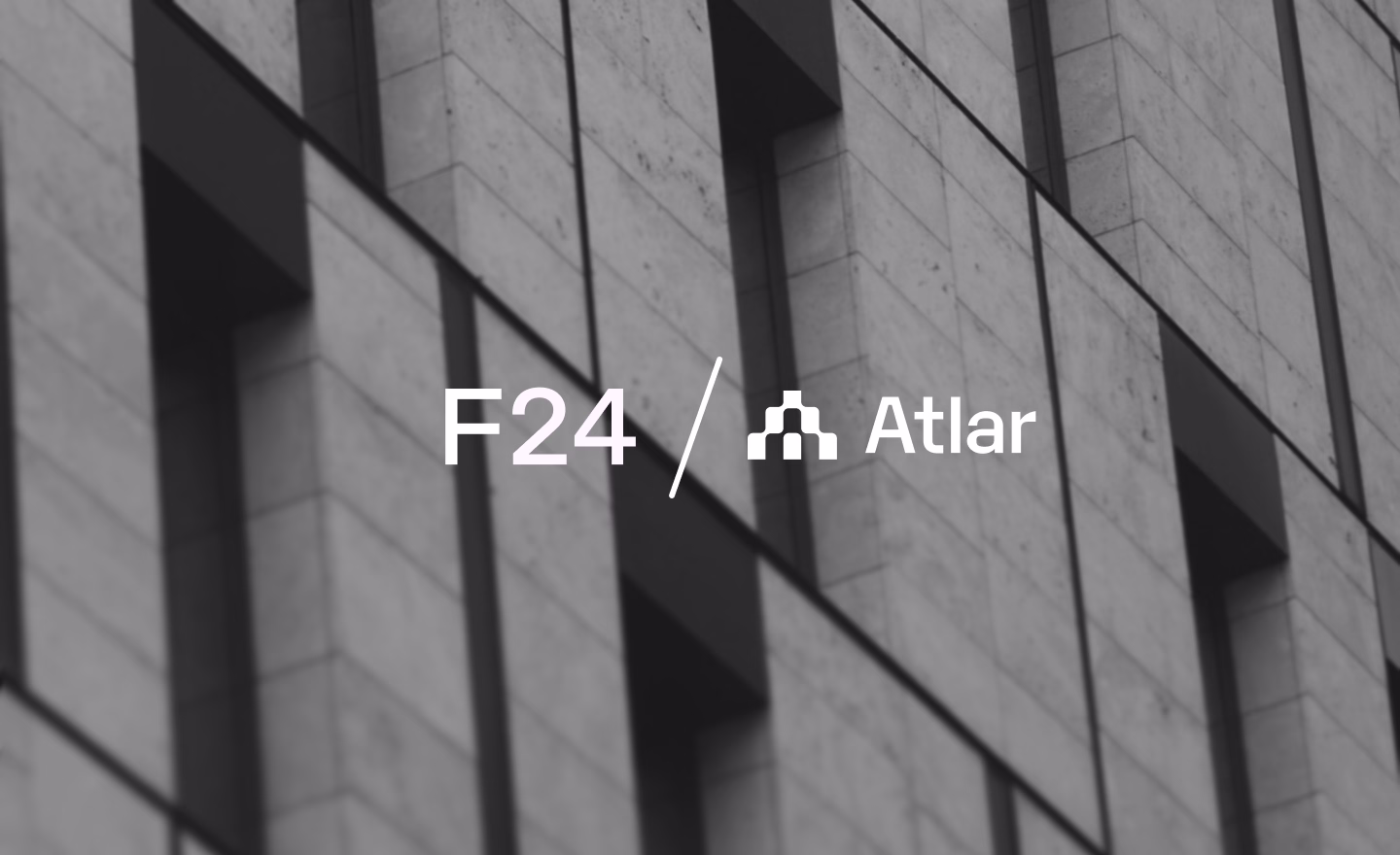 F24 and Atlar logos side by side over a blurred building facade, announcing the partnership