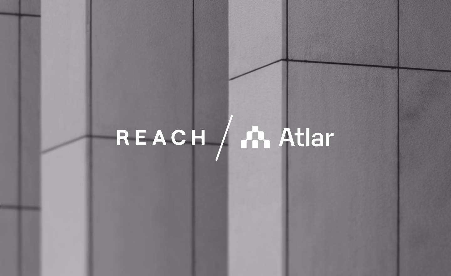 Reach and Atlar logos side by side over a blurred building facade, announcing the partnership
