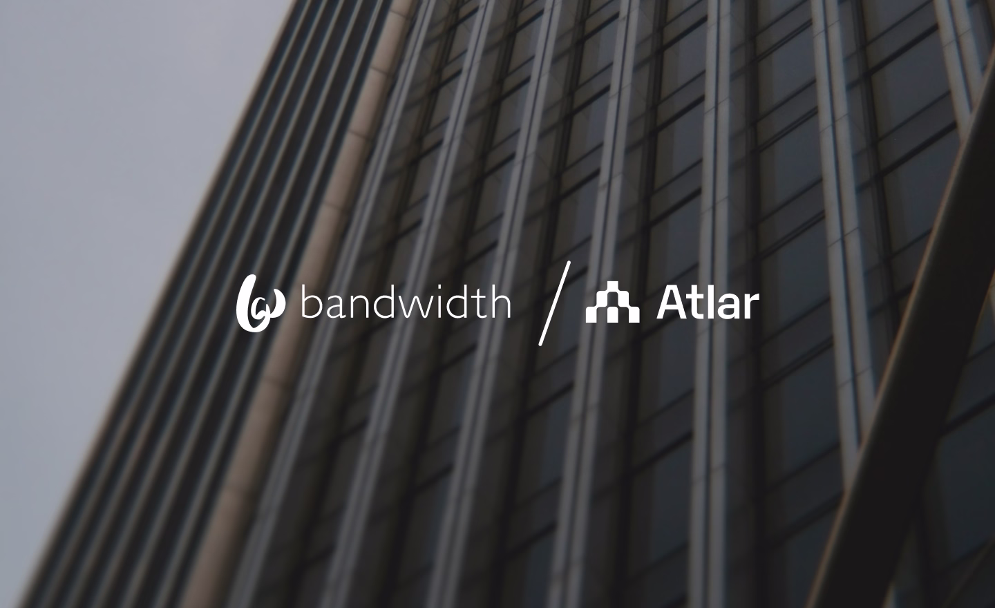 Bandwidth and Atlar logos side by side over a photo of a building facade, announcing the partnership