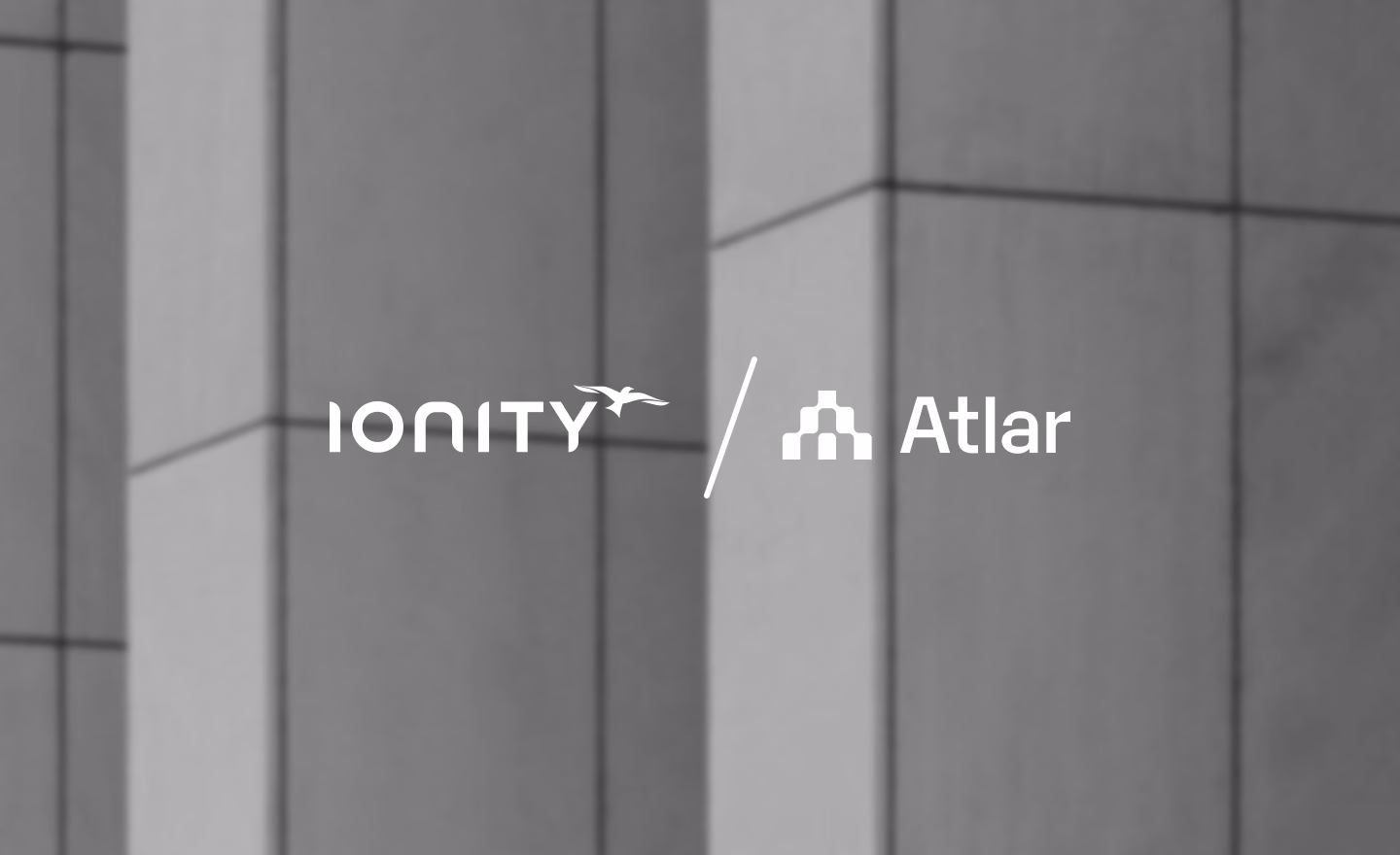 IONITY and Atlar logos side by side over a photo of a building facade, announcing the partnership