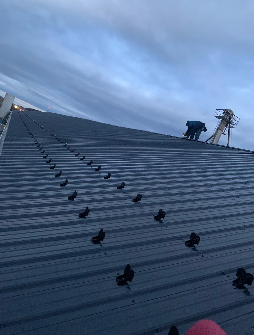 Finished metal roofing on a residential home completed by Tip Top Roofing & Siding for long-lasting protection.