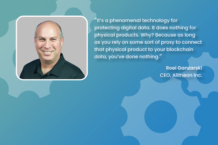 Portrait of smiling bald man with quote on technology protecting digital data from Roei Ganzarski.