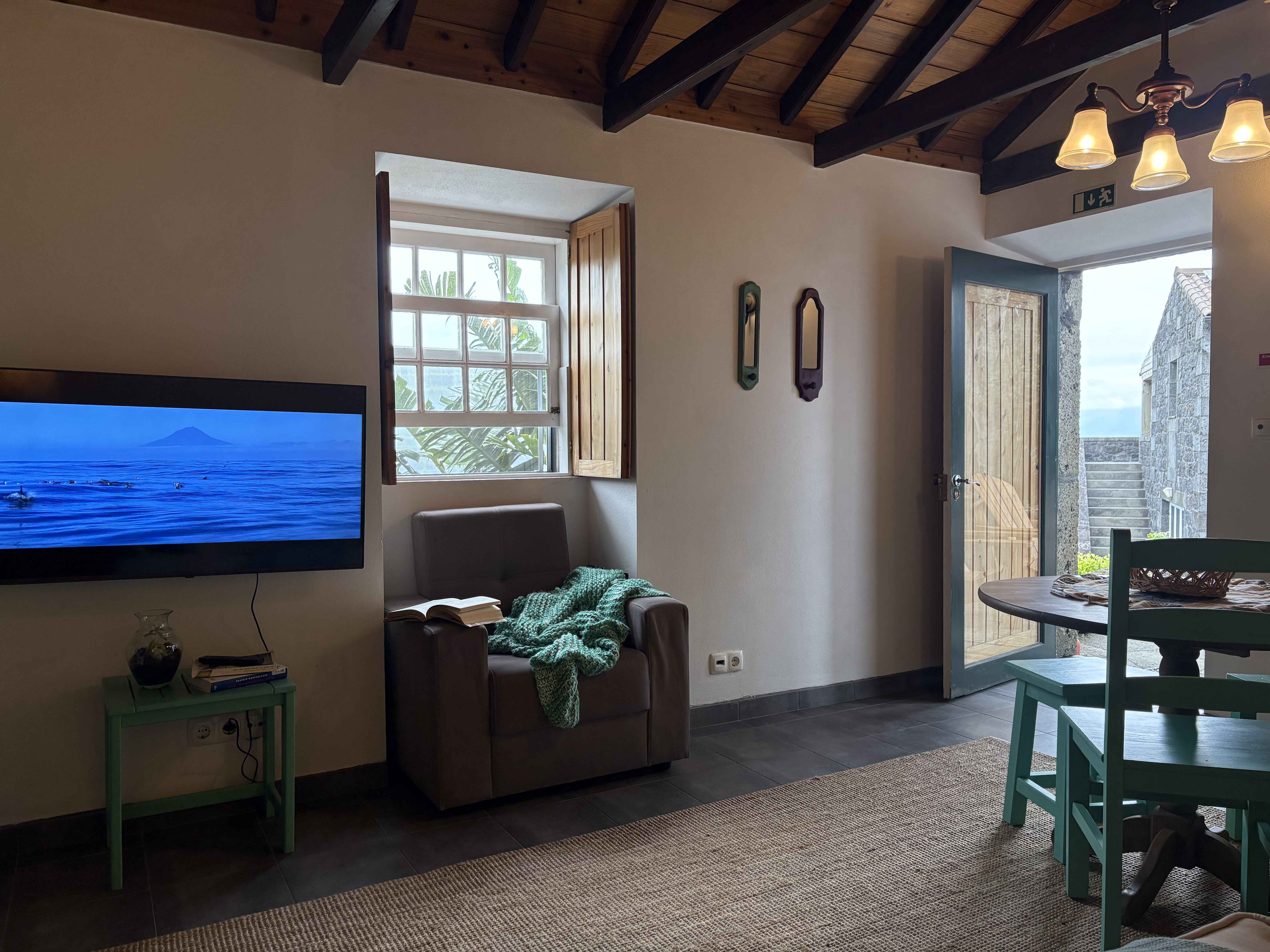 The living room at Casa do Laureano, a basalt stone cottage in Santo Amaro, Pico