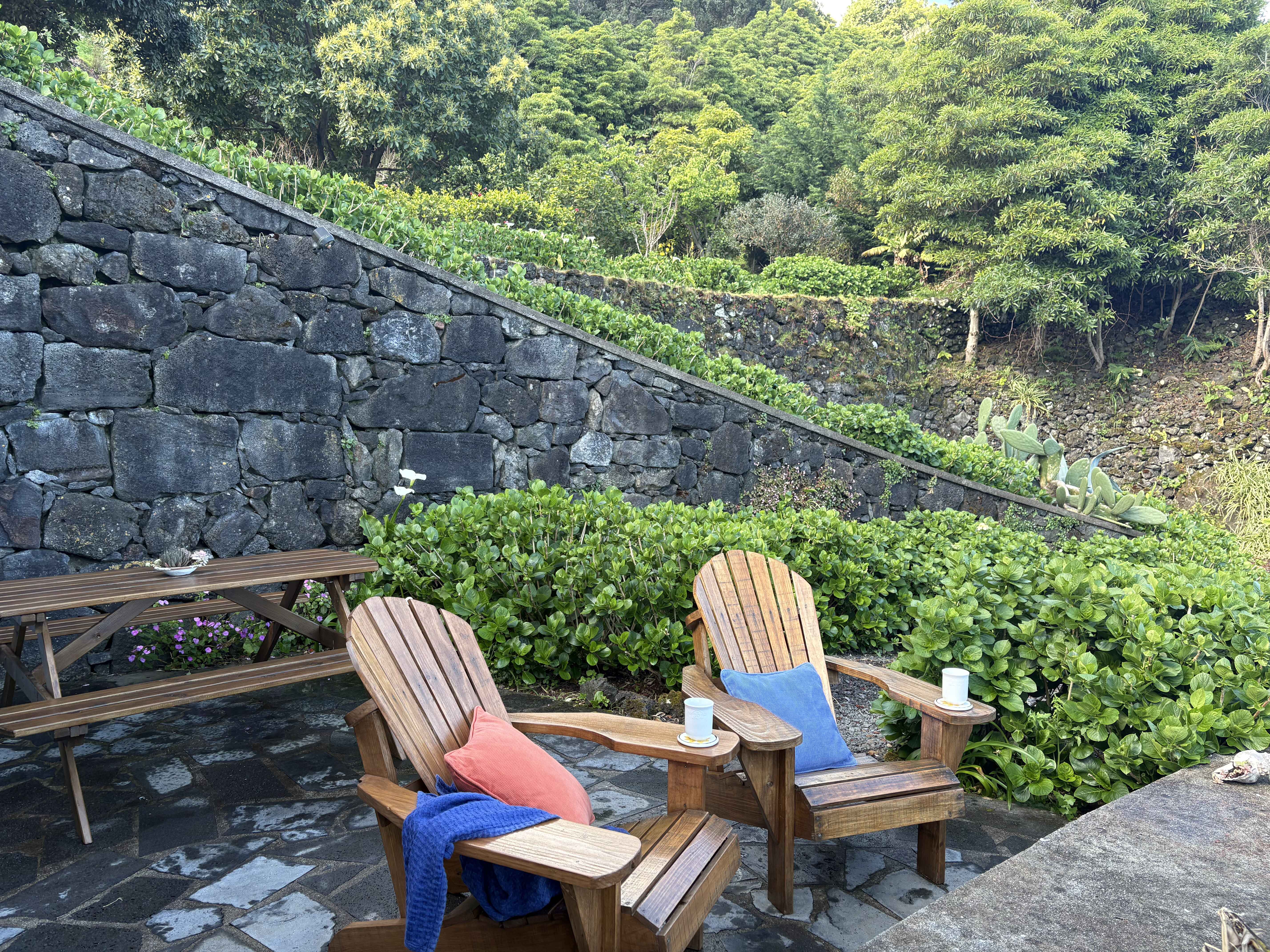 Inside Casa do Jardim, a basalt stone house at Highland Homes in Santo Amaro, Pico