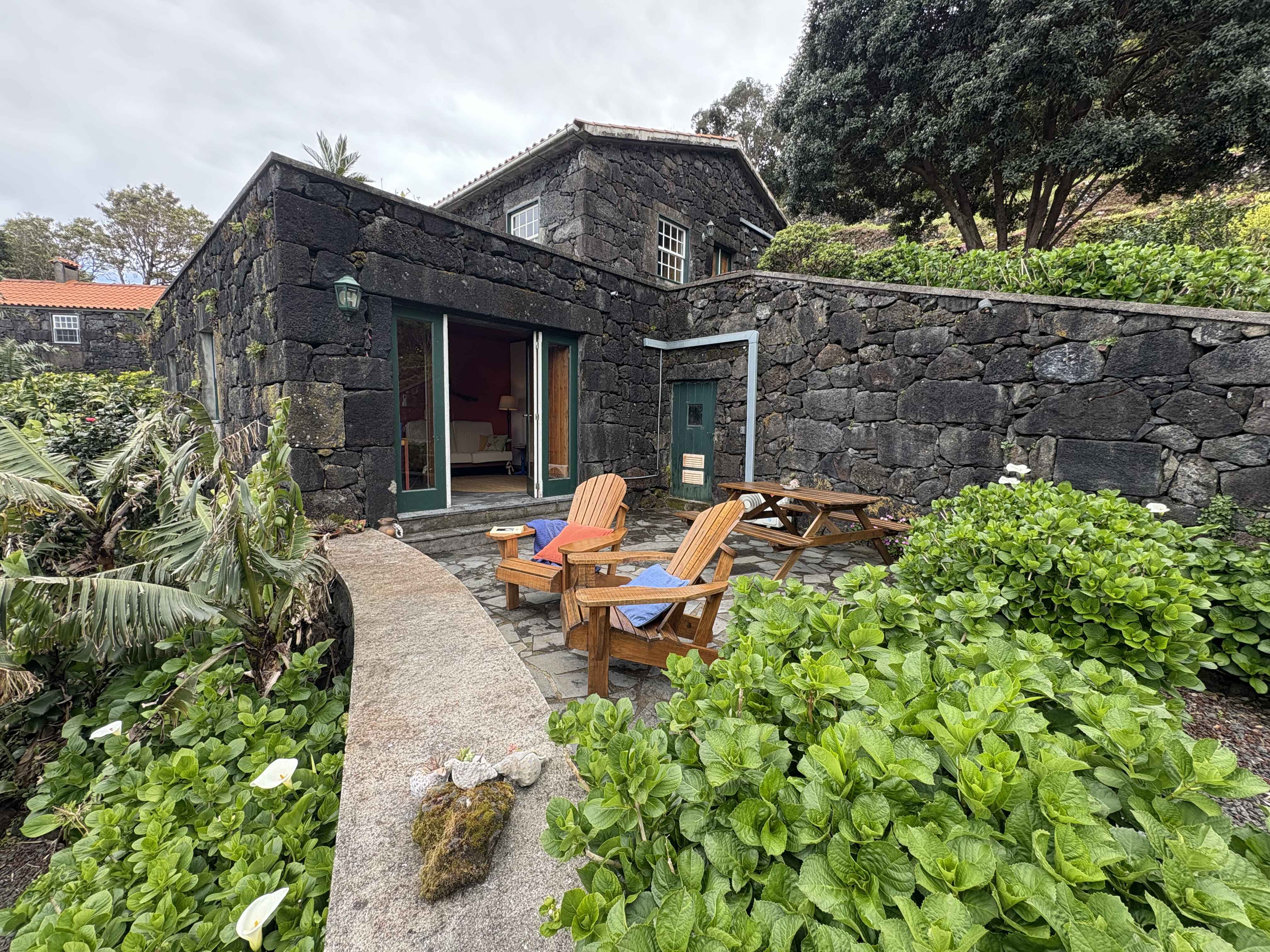 Casa do Jardim, a basalt stone house set in a garden full of life in Santo Amaro, Pico