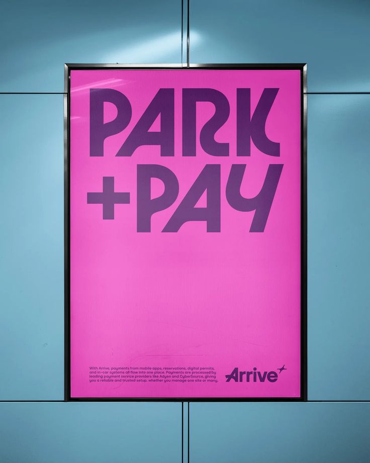 Magenta poster reading Park + Pay for Arrive, mounted in an illuminated transit lightbox