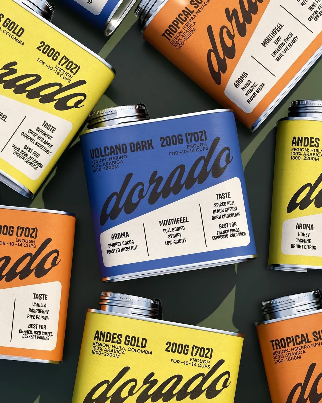 Overhead scatter of Dorado coffee cans in yellow, orange and cobalt blue