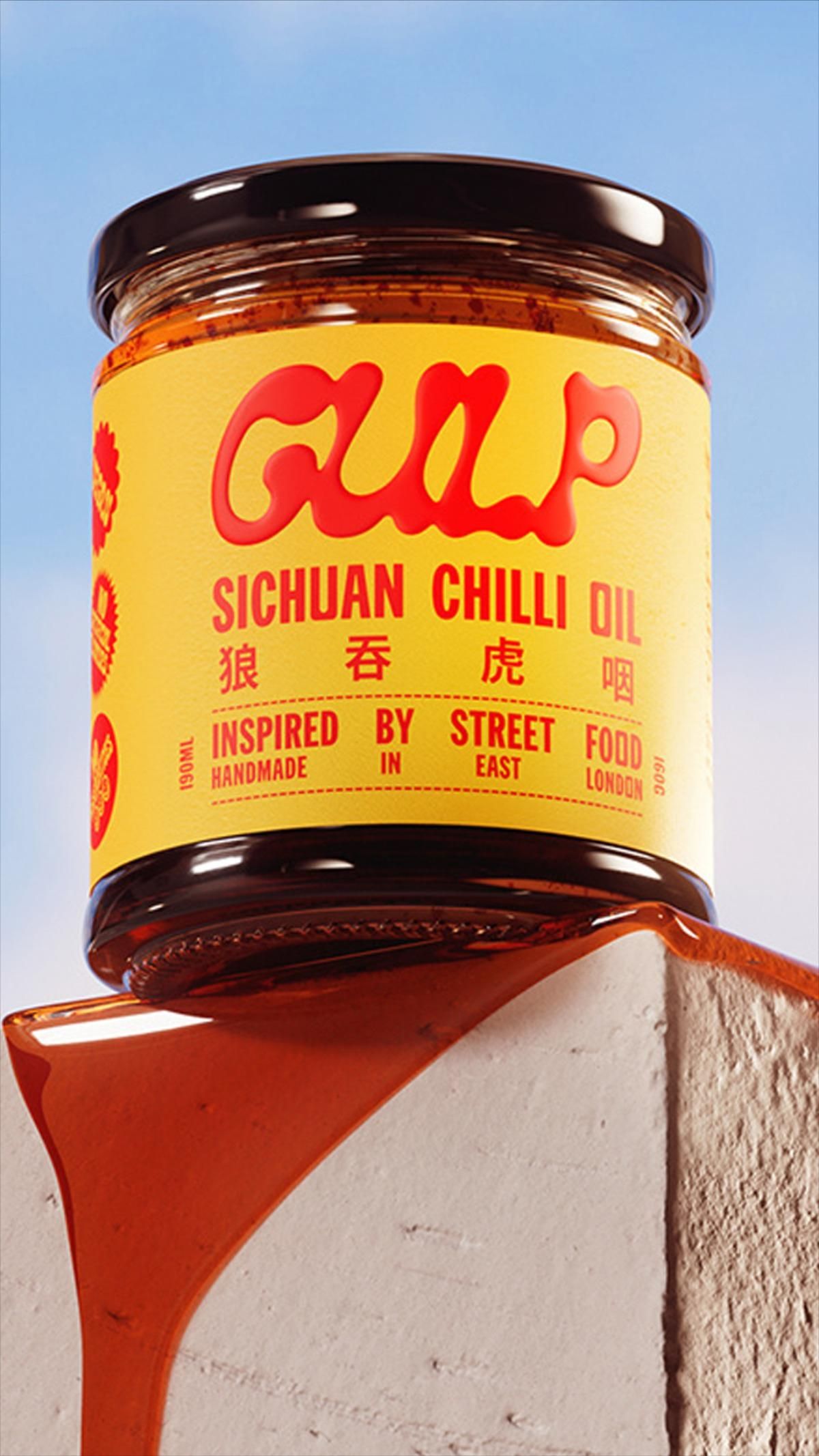Gulp Sichuan chilli oil jar with a yellow label, oil spilling down a plaster plinth