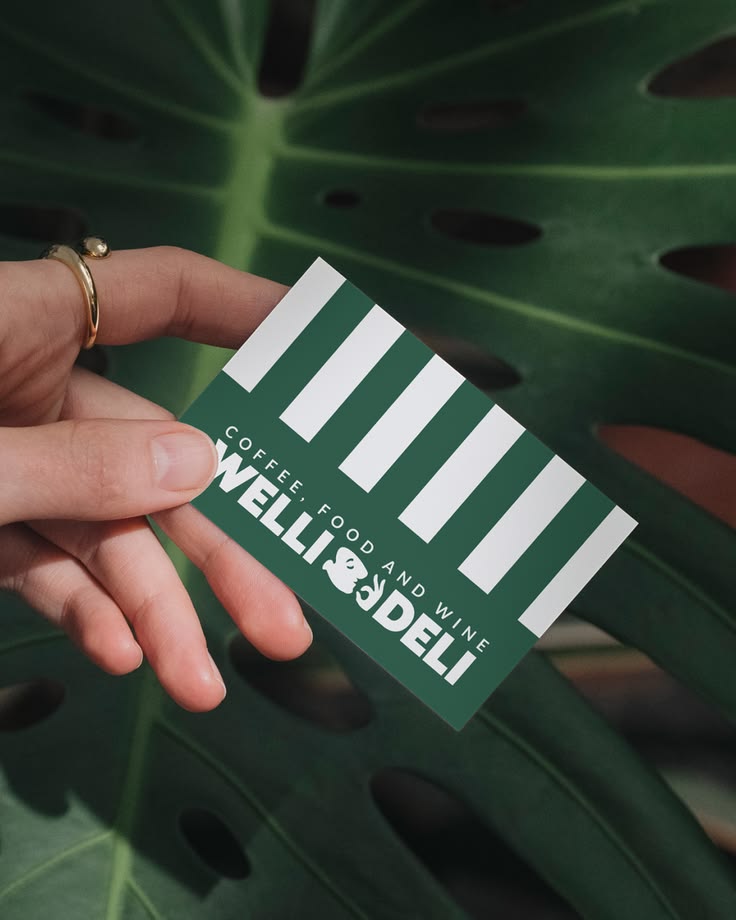 Welli Deli is a delicatessen and kitchen brand built to feel warm, characterful and craveable. A brand with personality that shows up consistently across every touchpoint -- from coffee cups and loyalty cards to apparel, packaging and in-store presen