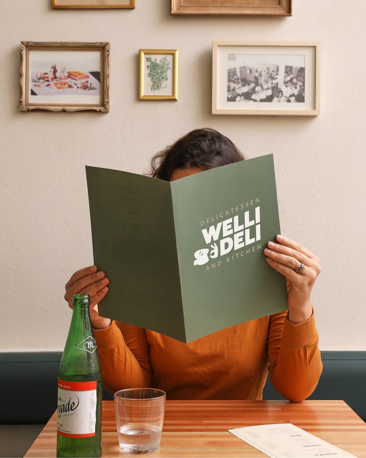 Welli Deli is a delicatessen and kitchen brand built to feel warm, characterful and craveable. A brand with personality that shows up consistently across every touchpoint -- from coffee cups and loyalty cards to apparel, packaging and in-store presen