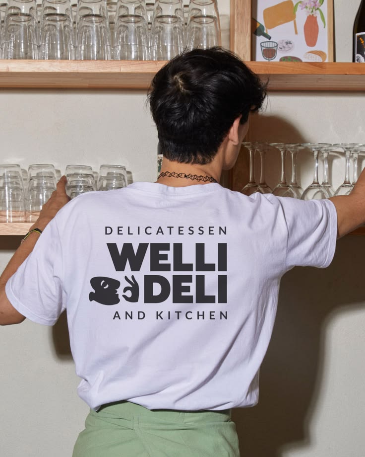 Welli Deli is a delicatessen and kitchen brand built to feel warm, characterful and craveable. A brand with personality that shows up consistently across every touchpoint -- from coffee cups and loyalty cards to apparel, packaging and in-store presen