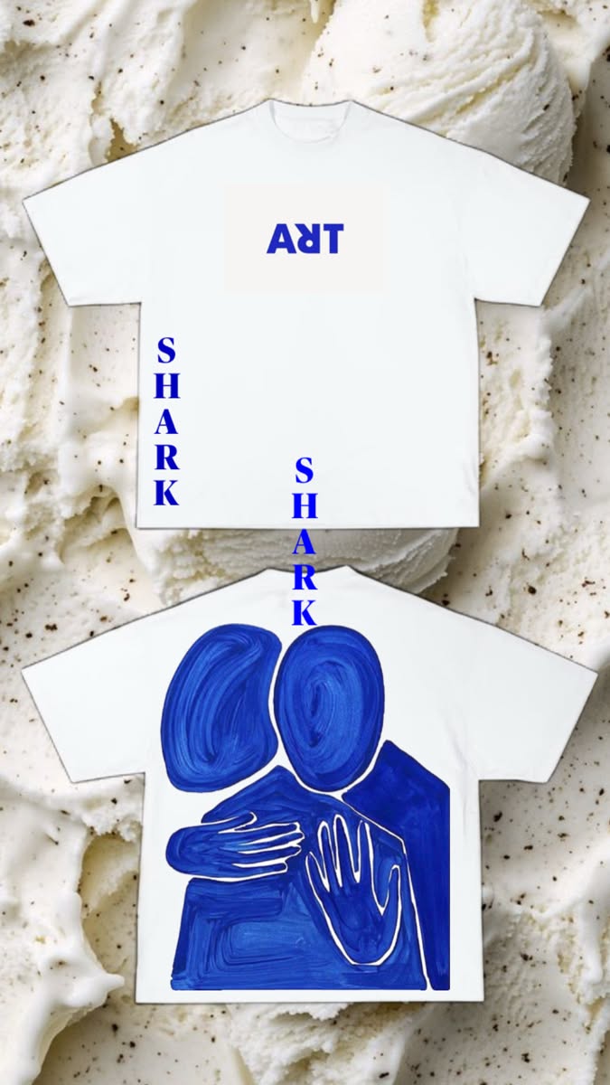 Two white T-shirts with cobalt blue lettering and a painted embracing figure, photographed on a bed of ice cream