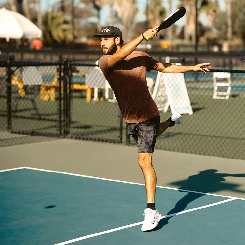man hitting a powerful forehand in the transition zone