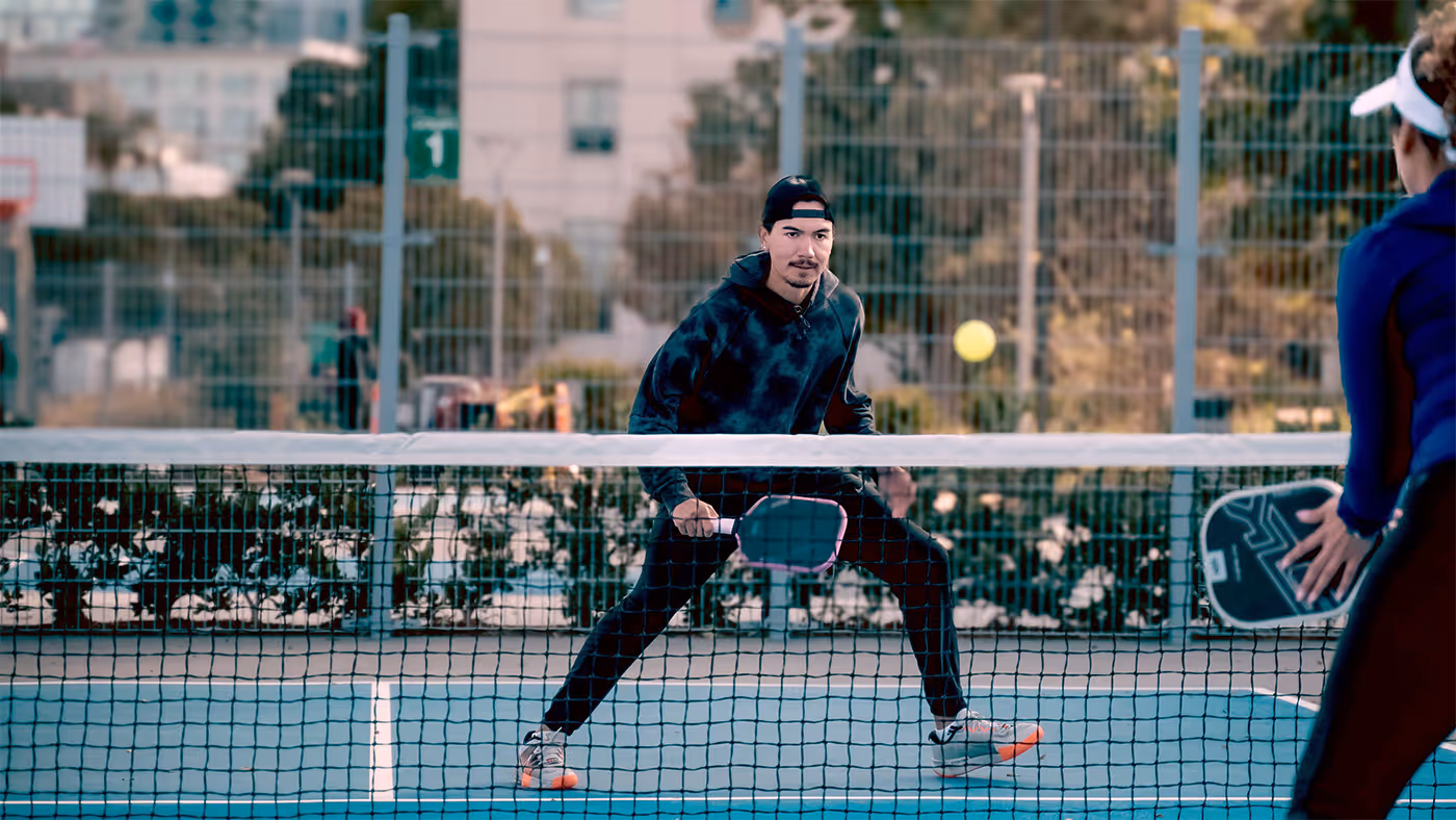 main waiting to receive opponent's ball in a pickleball game