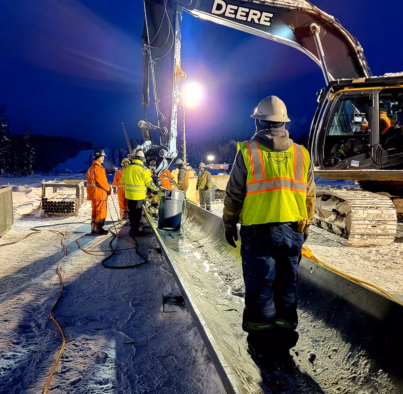 workers on a construction site at night