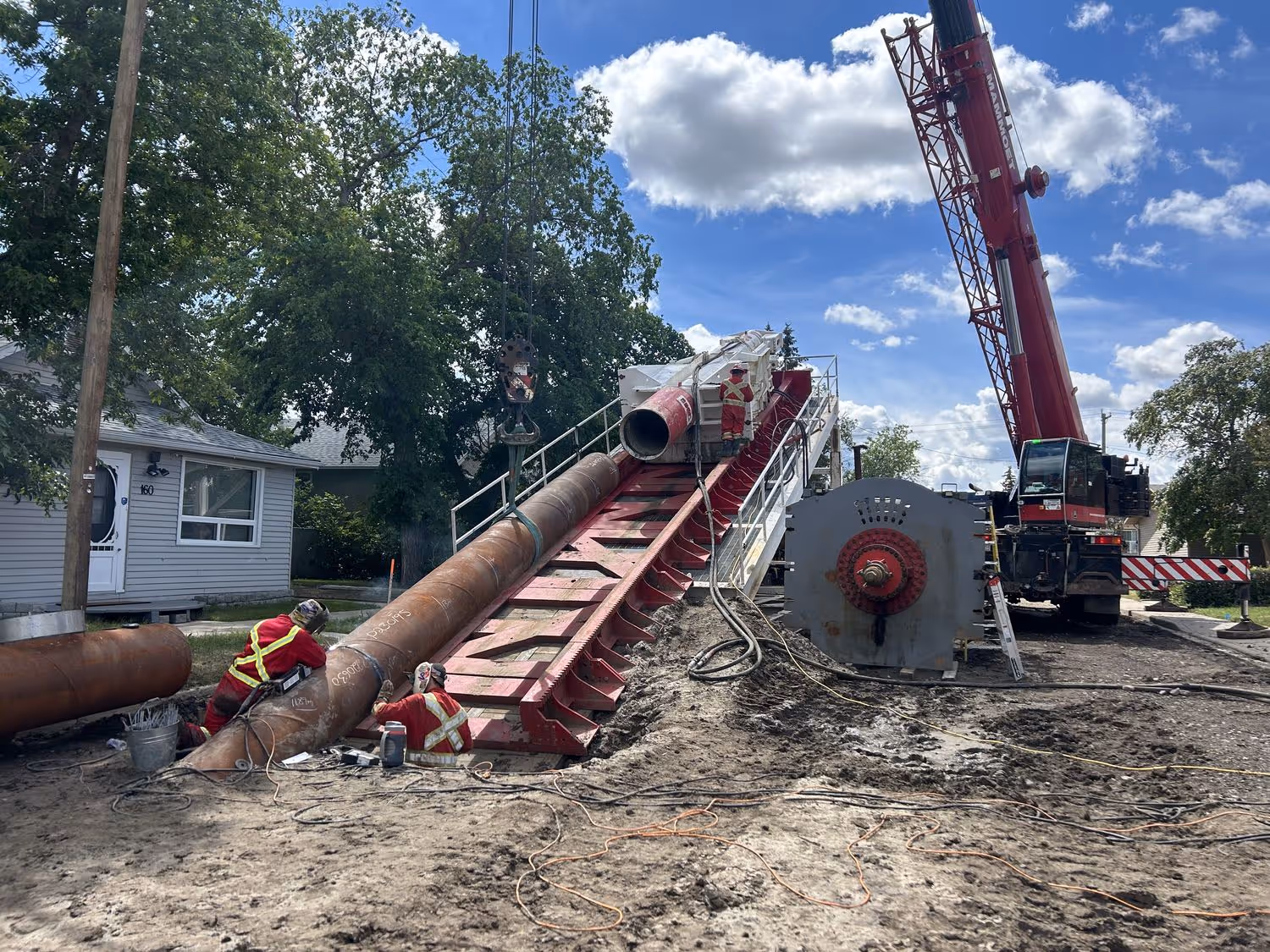 a pipeline is going into the road in a residential community
