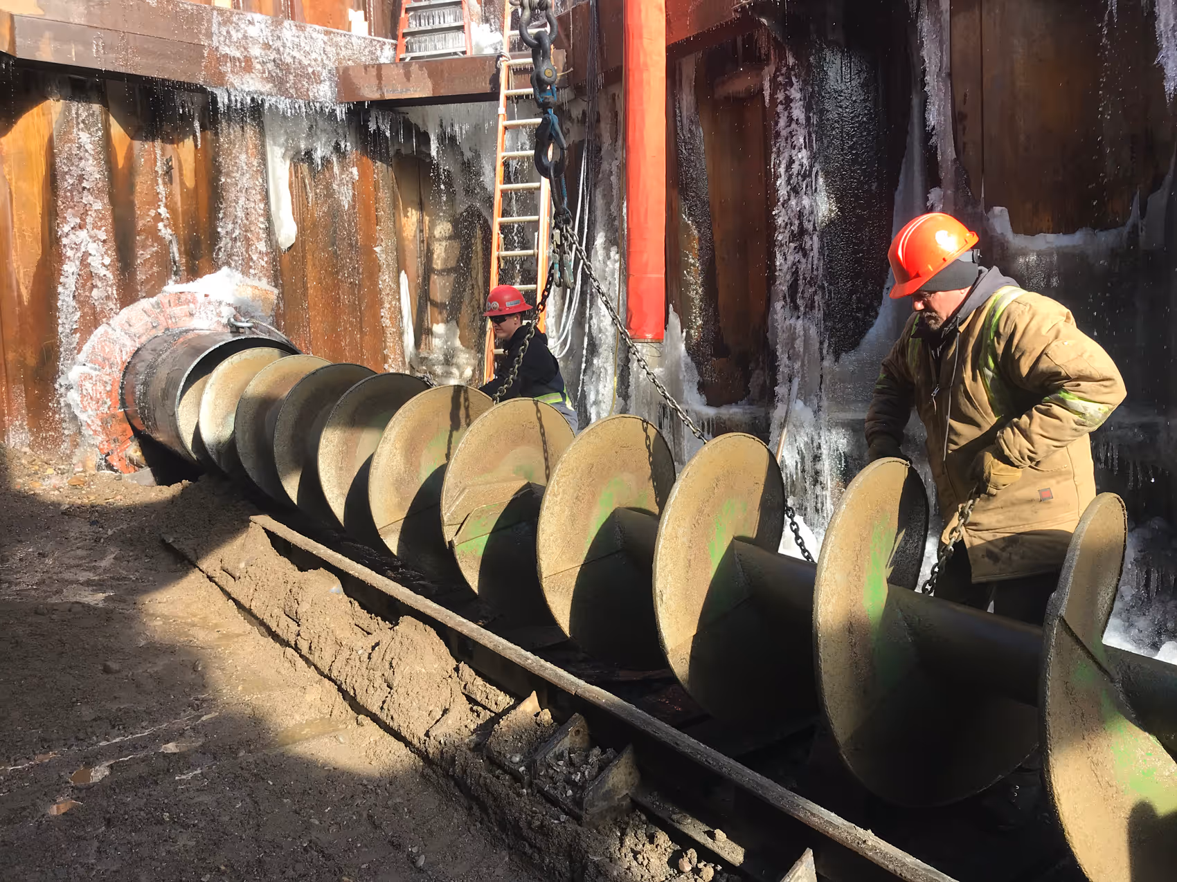 a large auger is going into the entry hole