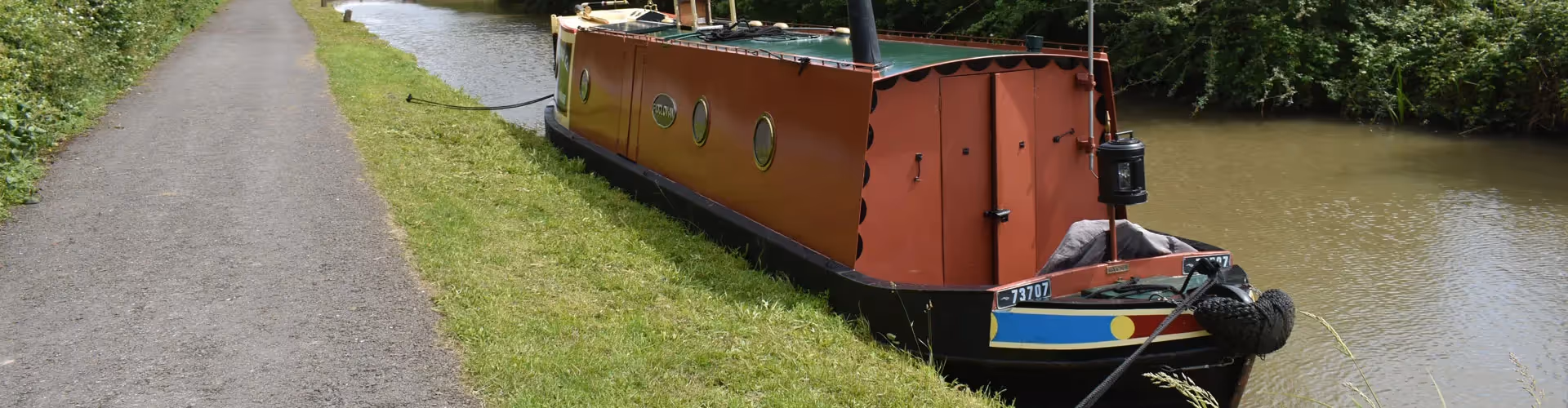A narrowboat moored at a canal