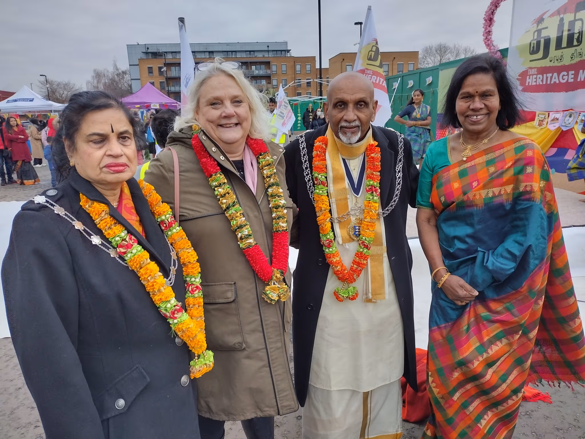 Kingston's Chief Executive Sarah Ireland, past Mayor Yogan Yoganathan and local residents at a celebratory event in Kingston