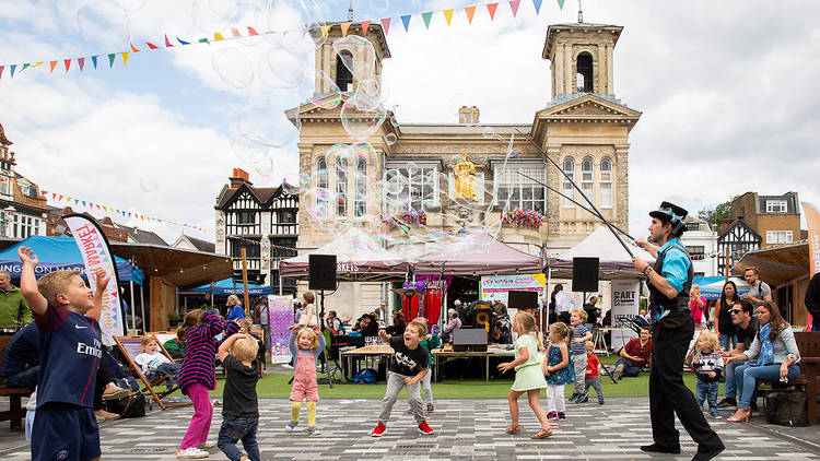People and children having fun in Kingston town centre at a celebratory event