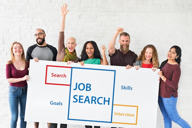 A stock image showing people searching for jobs