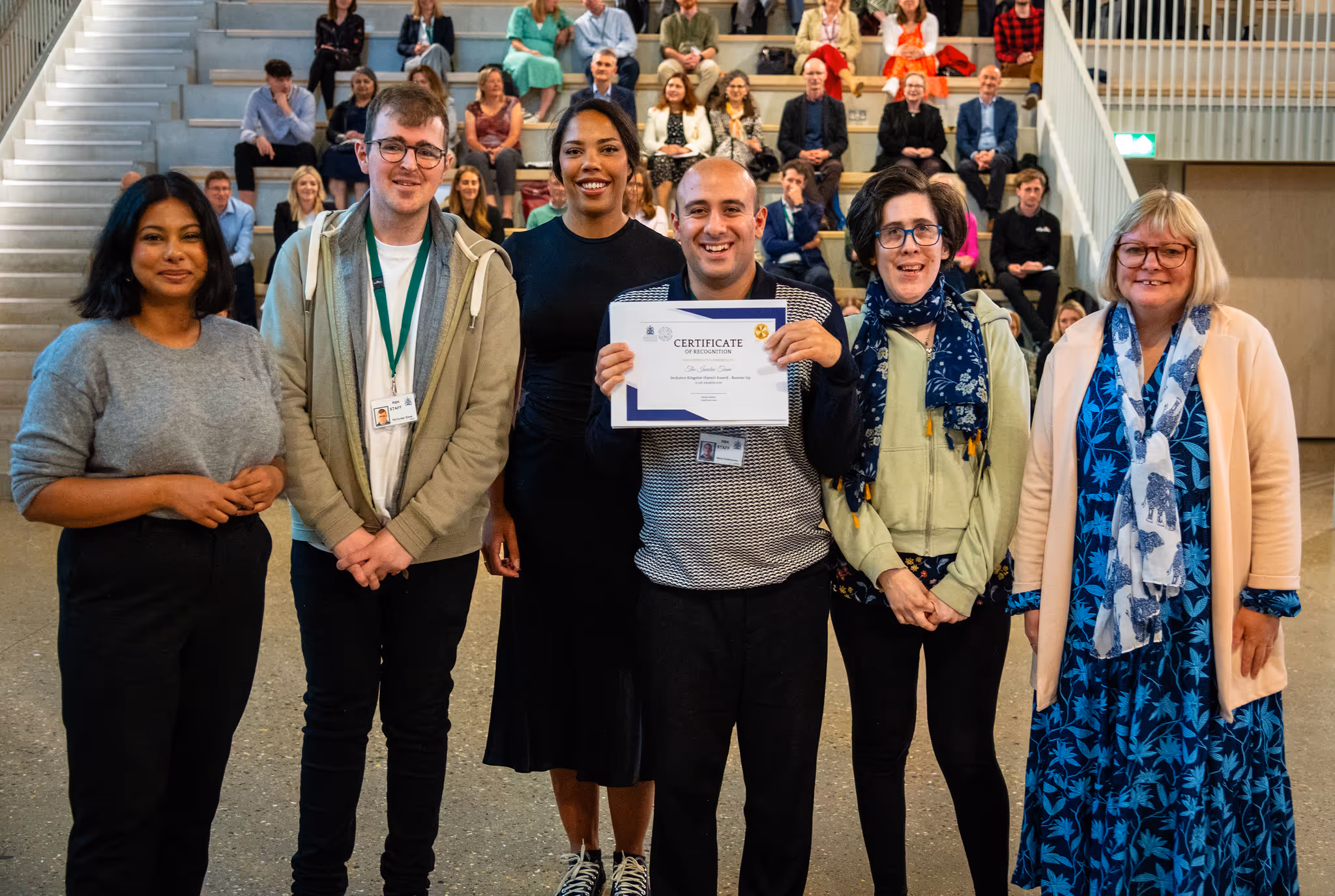 Kingston staff members accepting their certificates at Kingston Staff Awards Ceremony
