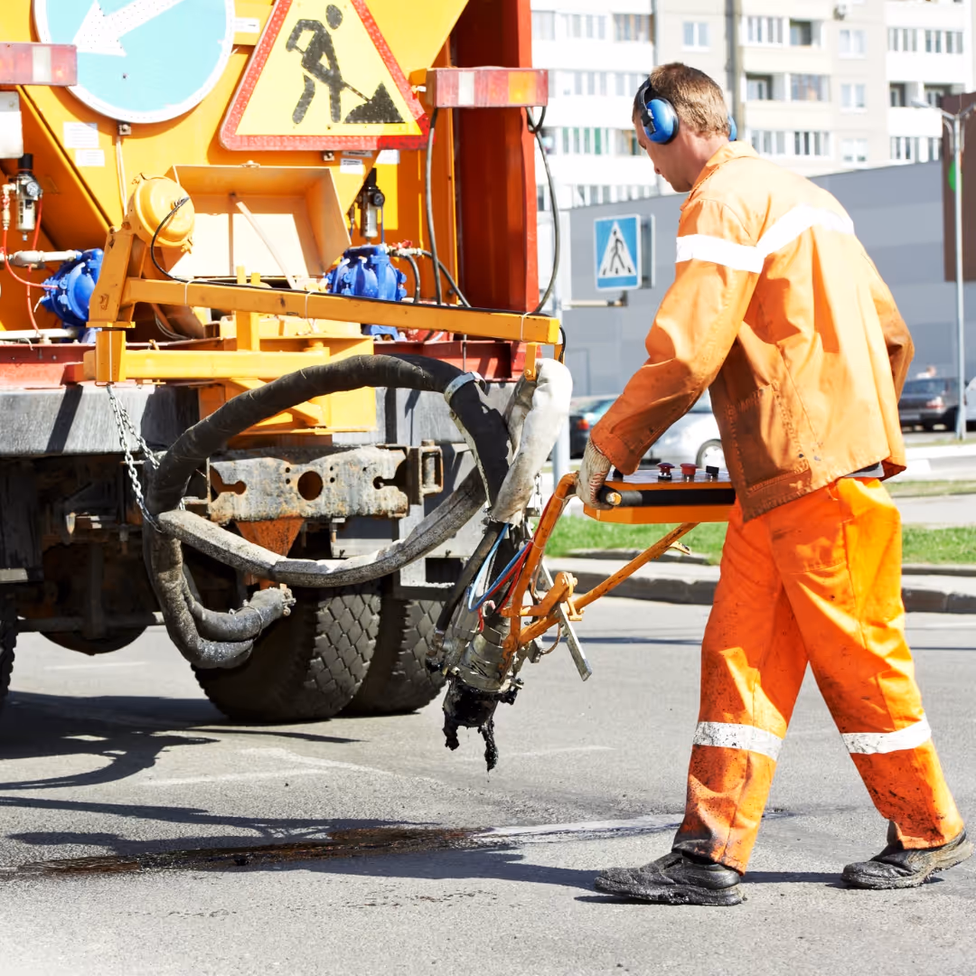 A cyclist cycling through Kingston showing cycle lanes, which are designed by Kingston's Highways and Transport Team as part of the highways infrastructure