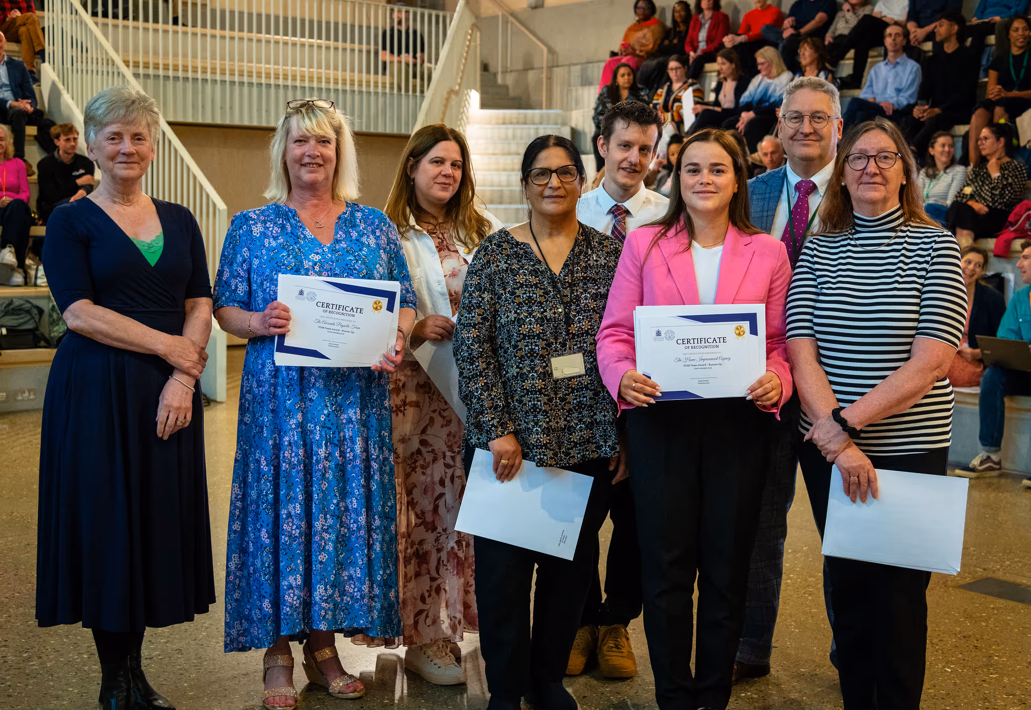 Kingston Council staff members in the Finance Shared Service, accepting an award at an annual staff awards ceremony