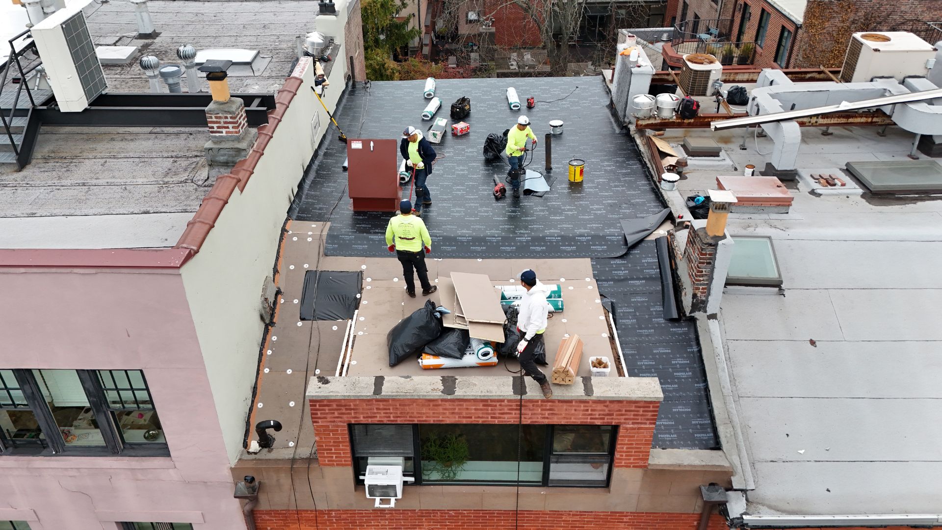 Big Apple install Elastoflex SA V Base Sheet to a Brooklyn home's flat roof
