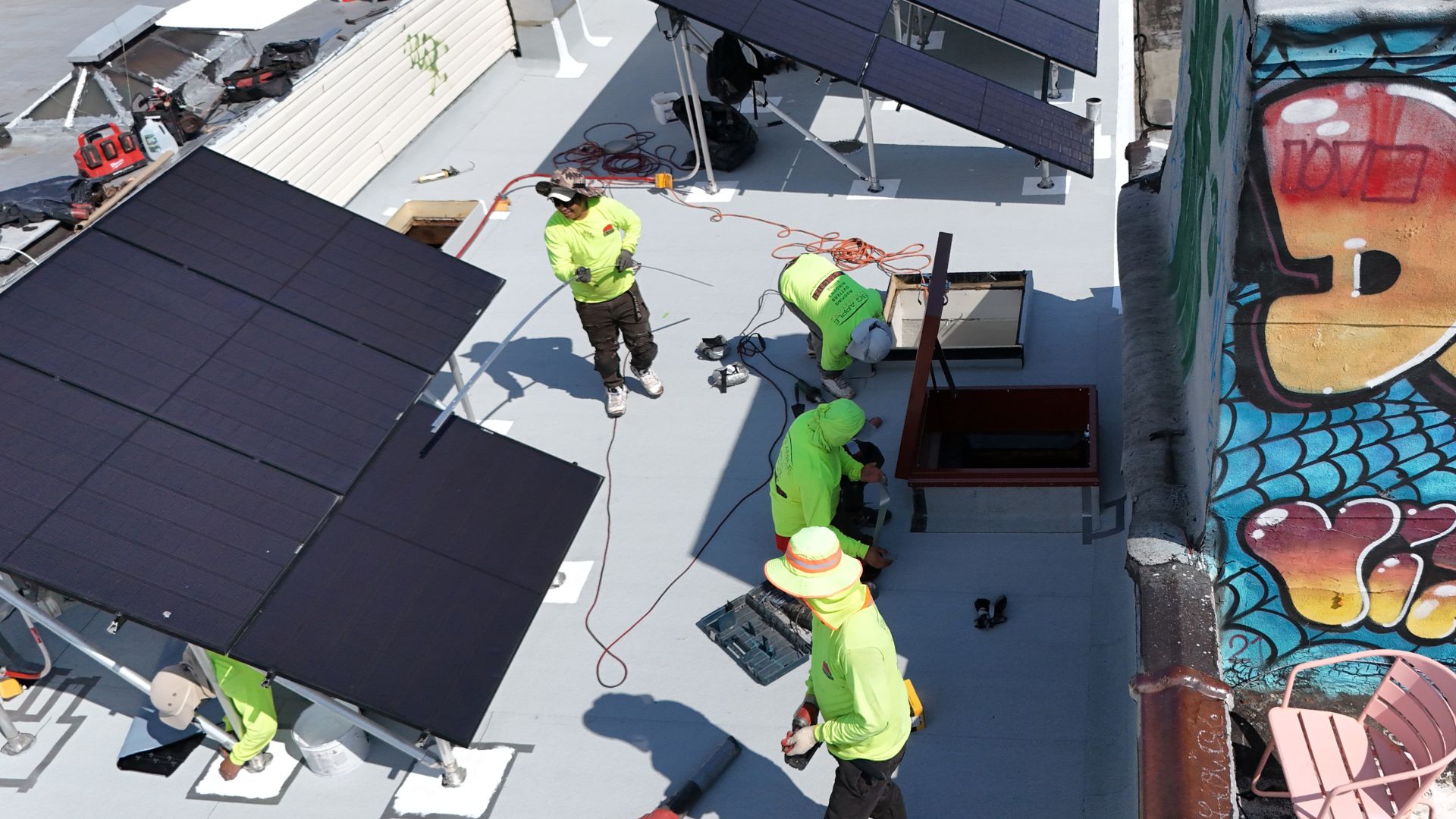 Big Apple repair and replace a flat residential roof in Brooklyn while navigating solar panels