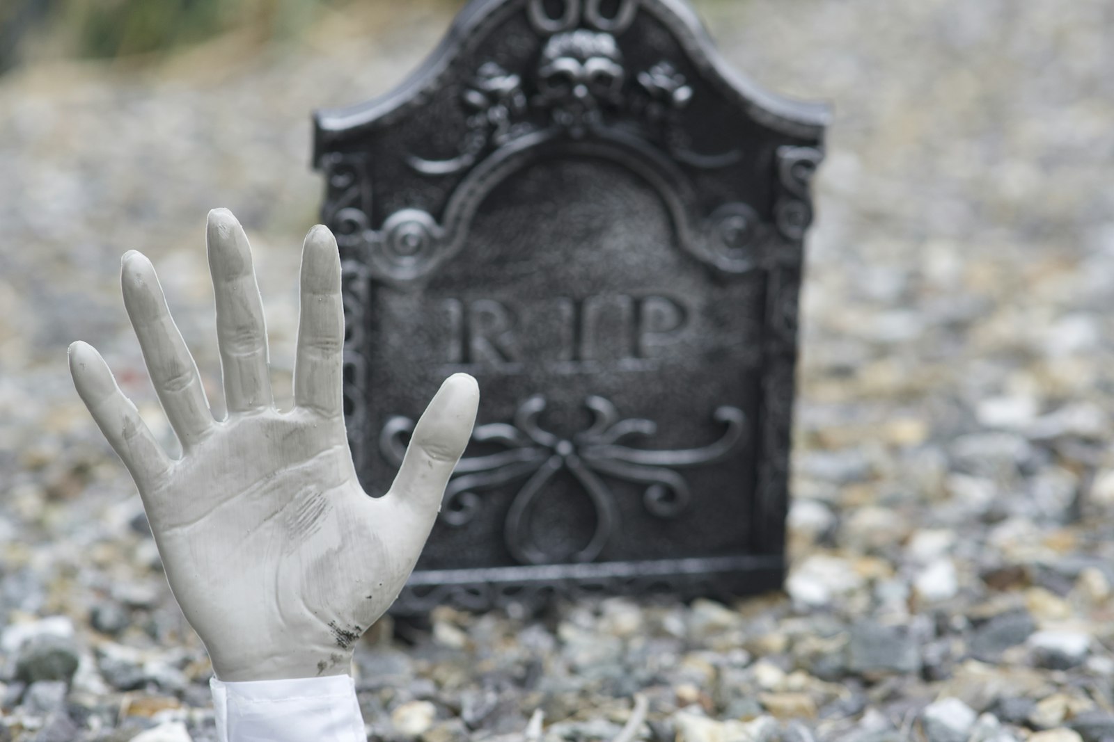 a hand that is in front of a grave