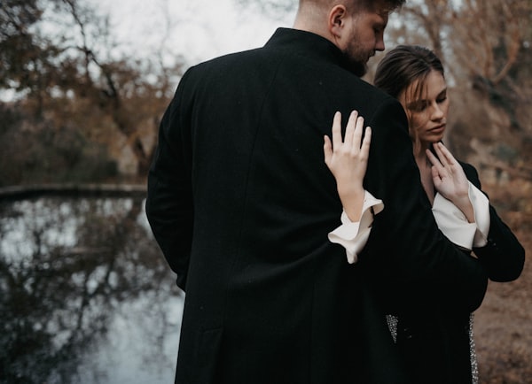 a man and a woman standing next to each other