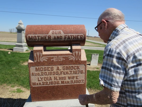 a man standing in front of a monument