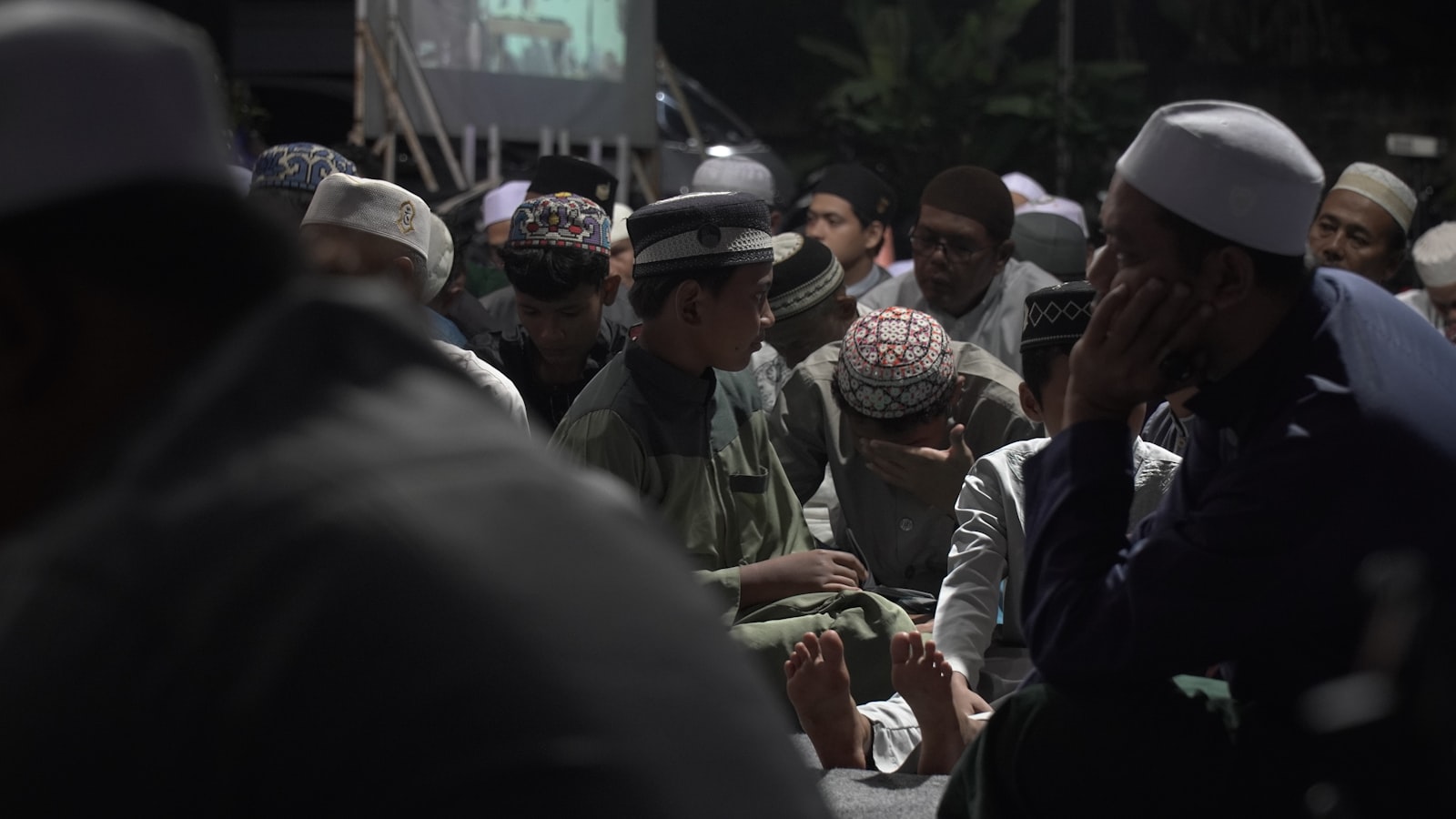 A group of people standing around each other