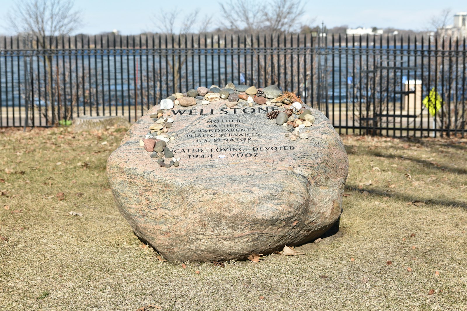 a large rock sitting in the middle of a field