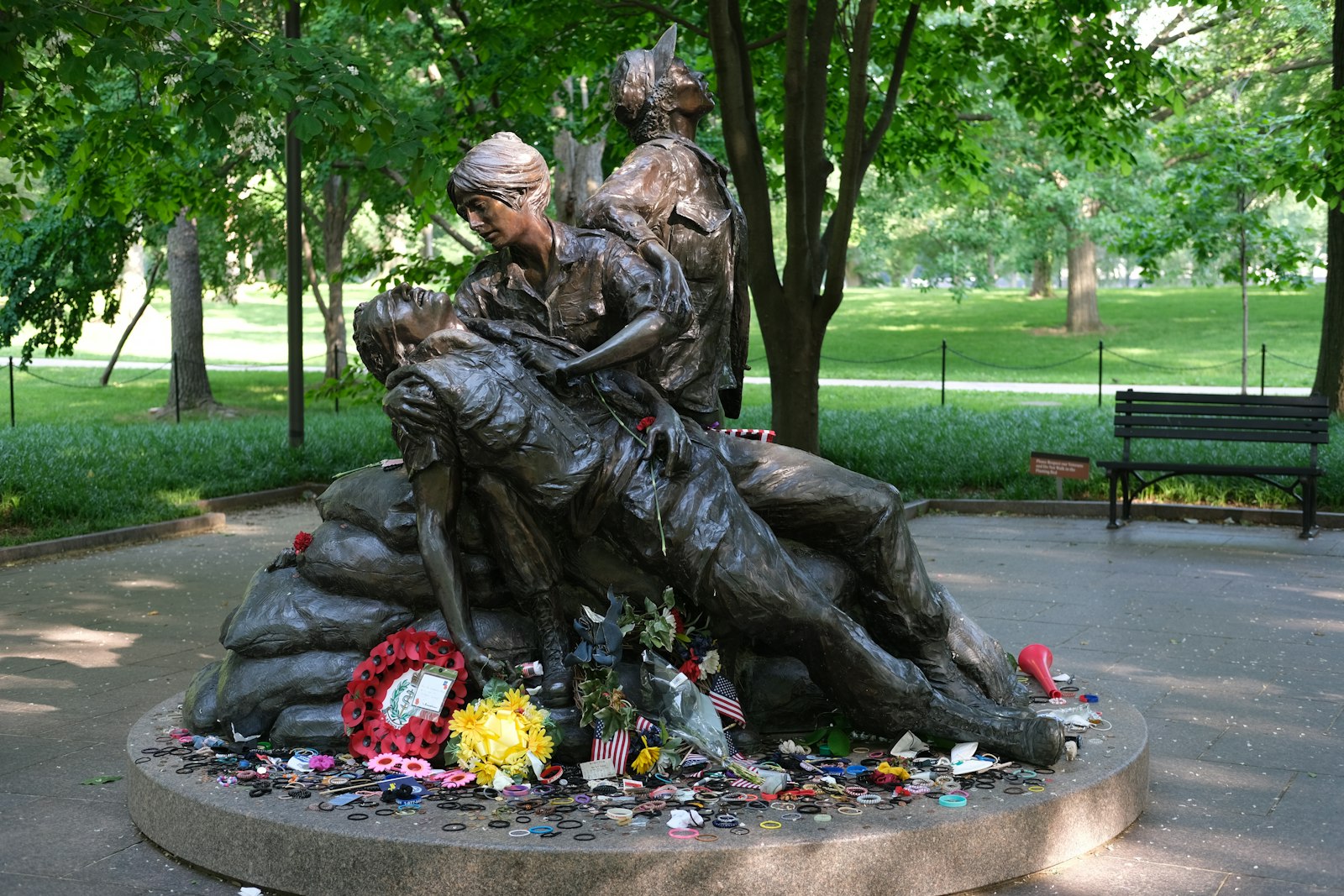 a statue of two people sitting on a bench