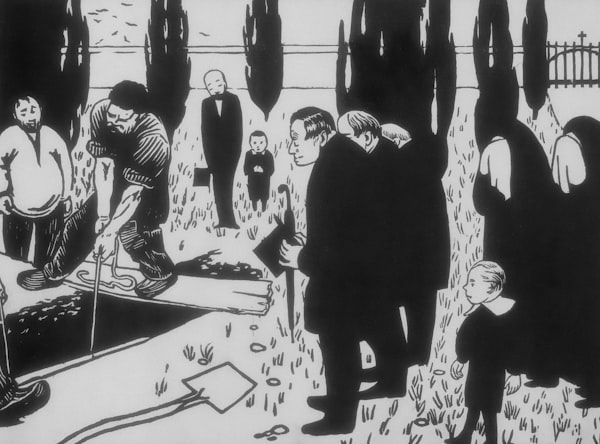 People gather at a funeral with a coffin being lowered.