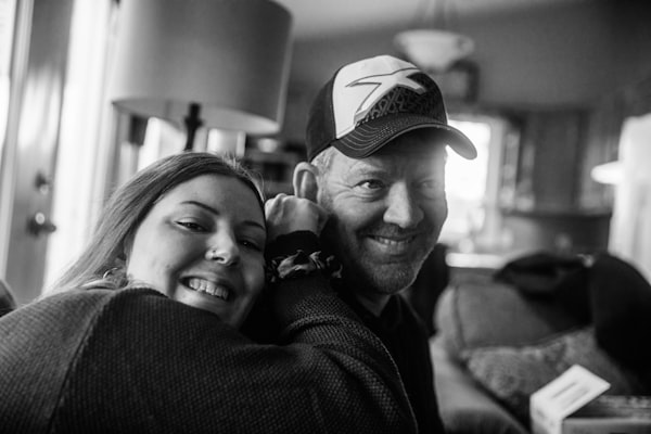 grayscale photo of man and woman smiling