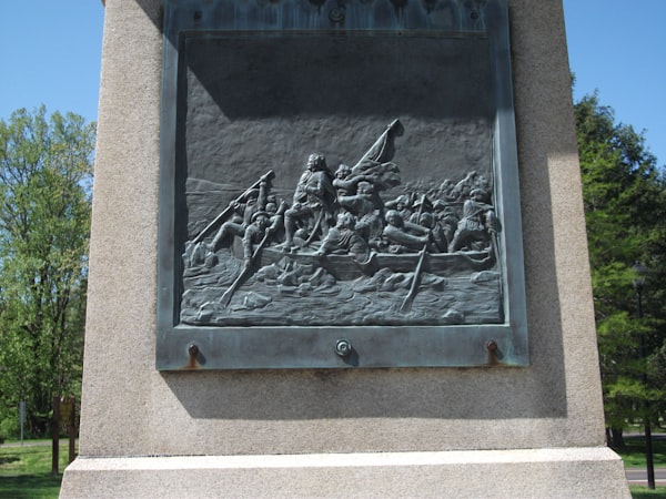 a monument with a picture of a man on a boat