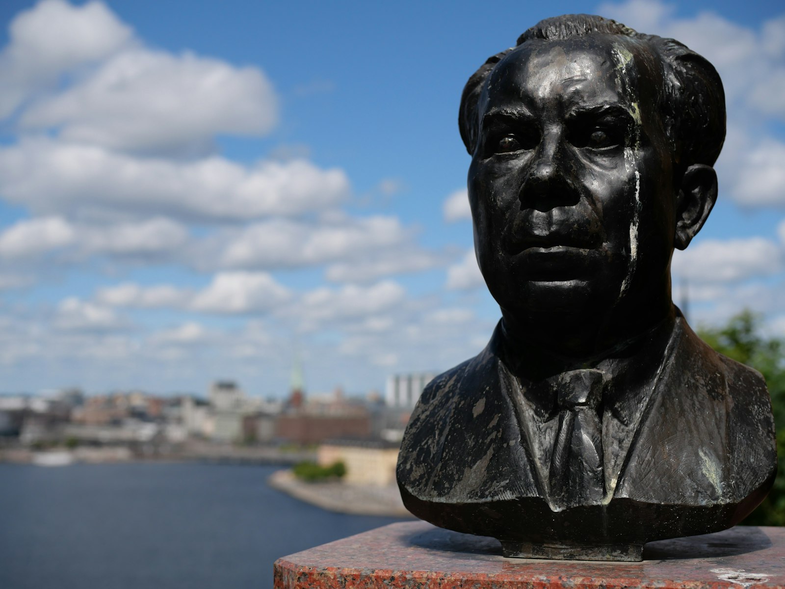 a statue of a man in a suit and tie