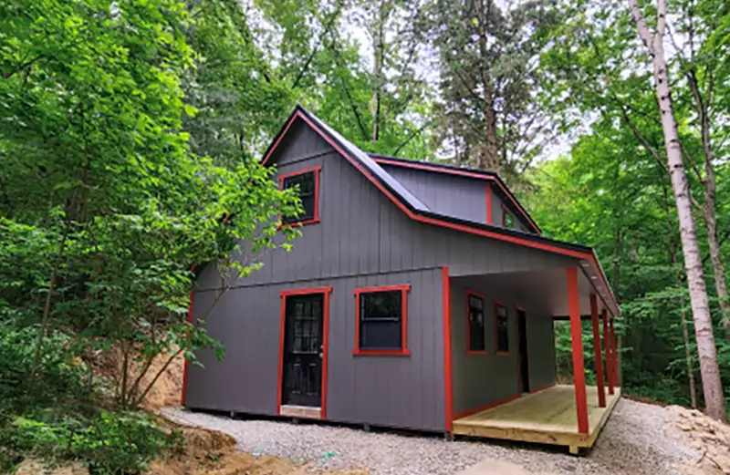 cabin with a porch and side door