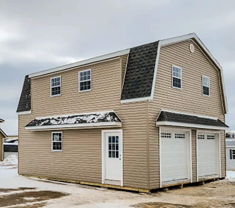 2 story cabin with 2 overhead doors