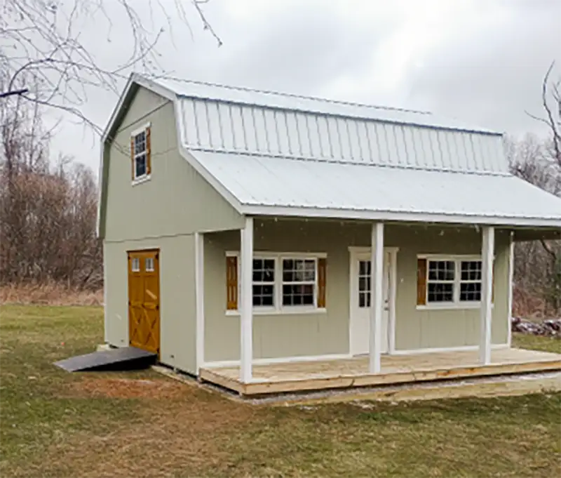 cabin with porch and side door with ramp
